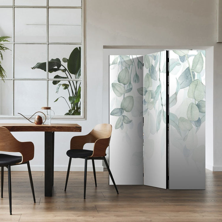 a botanical design 3 panels room divider in a modern dining room, you can see a dining table along with two chairs that give the charming effect of a modern home with botanical design