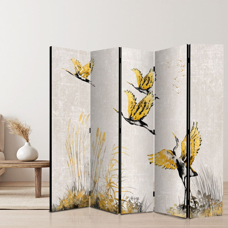 5 panels room divider screen with printed design of yellow birds just taking off, this folding screen is standing on a living room with rustical design