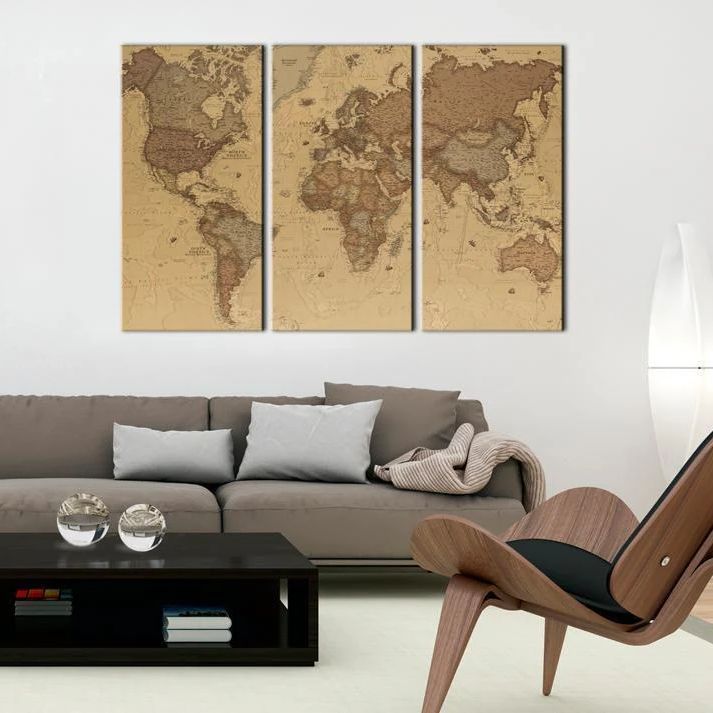 a living room with a large world map canvas in the shades of brown