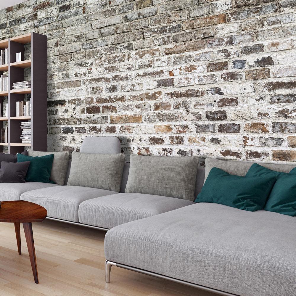 a lovely living room with exposed brick wallpaper style mounted on the living room wall
