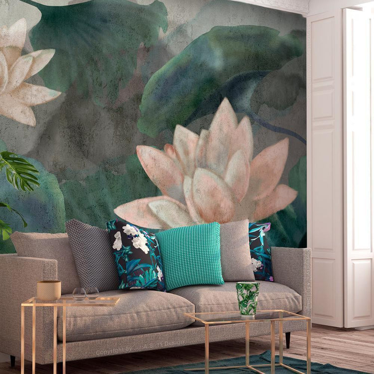 A living room with a large, brown couch facing a colorful mural of a pond with lilac water lilies