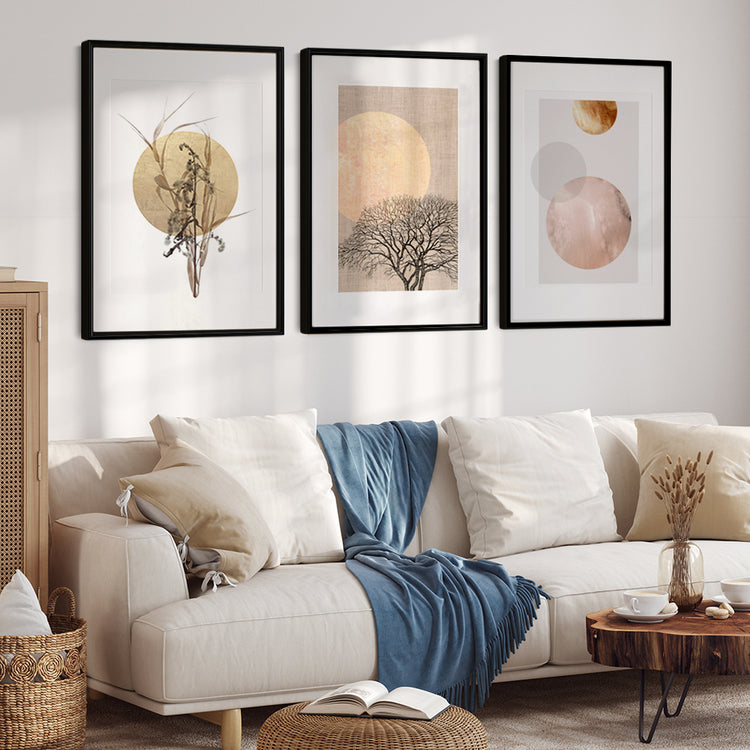 a living room with 3 framed posters with golden color designs, they add a touch of luxury to home decor wall art
