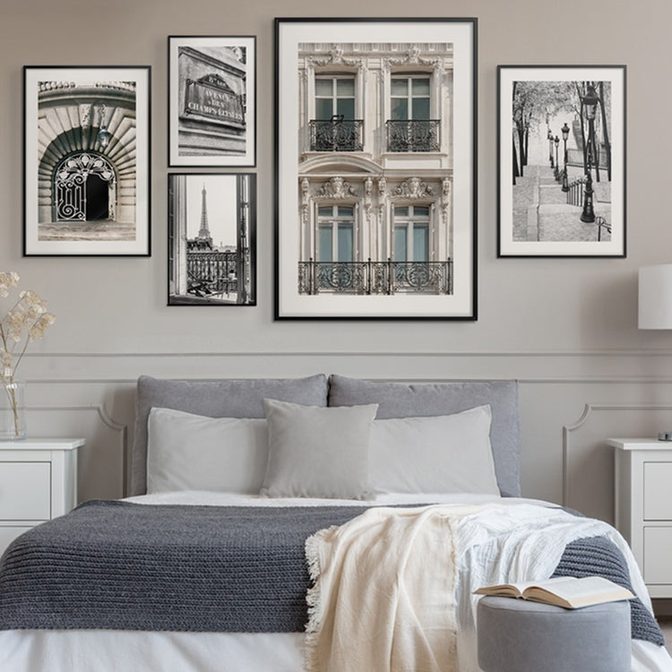 wall art posters of famous cities in a bedroom