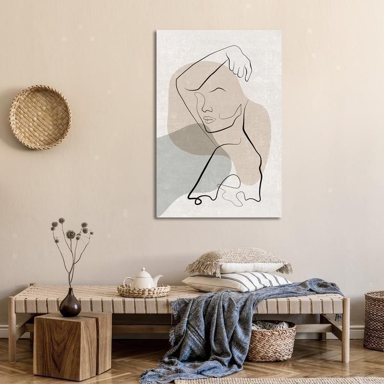 a living room with a canvas of a person silhouette