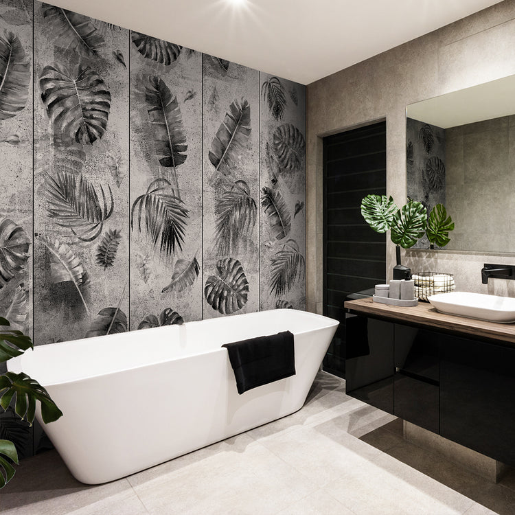 A Stylish and modern bathroom with a big bath and there's a grey wallpaper with botanical design next to the bath