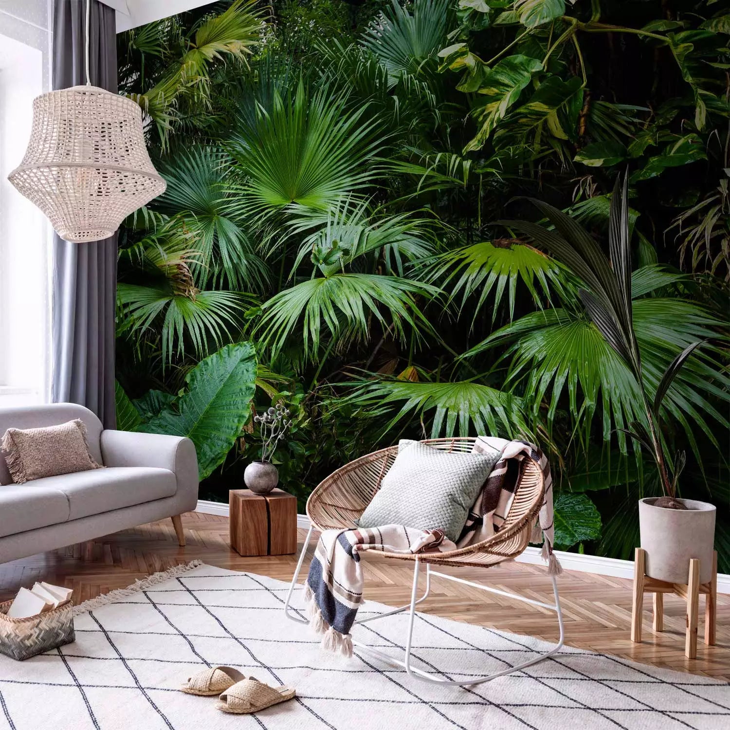 a jungle style wall mural in a living room next to a sofa and a cozy chair